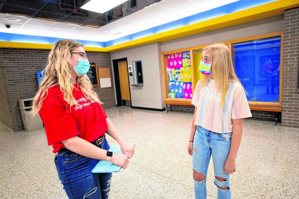 Greenfield-central High School teacher Carolyn Beach, left, talks with student Brynn Elliott. ( Tom Russo | Daily Reporter)