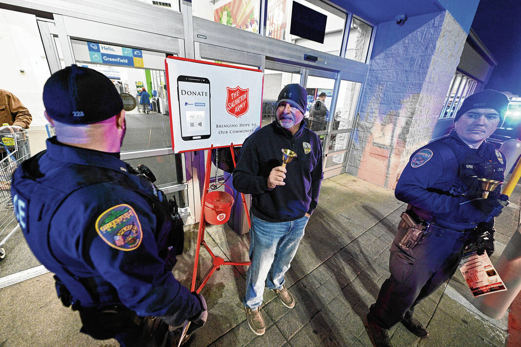 The Salvation Army's red kettle bells ring outside Kroger this holiday  season